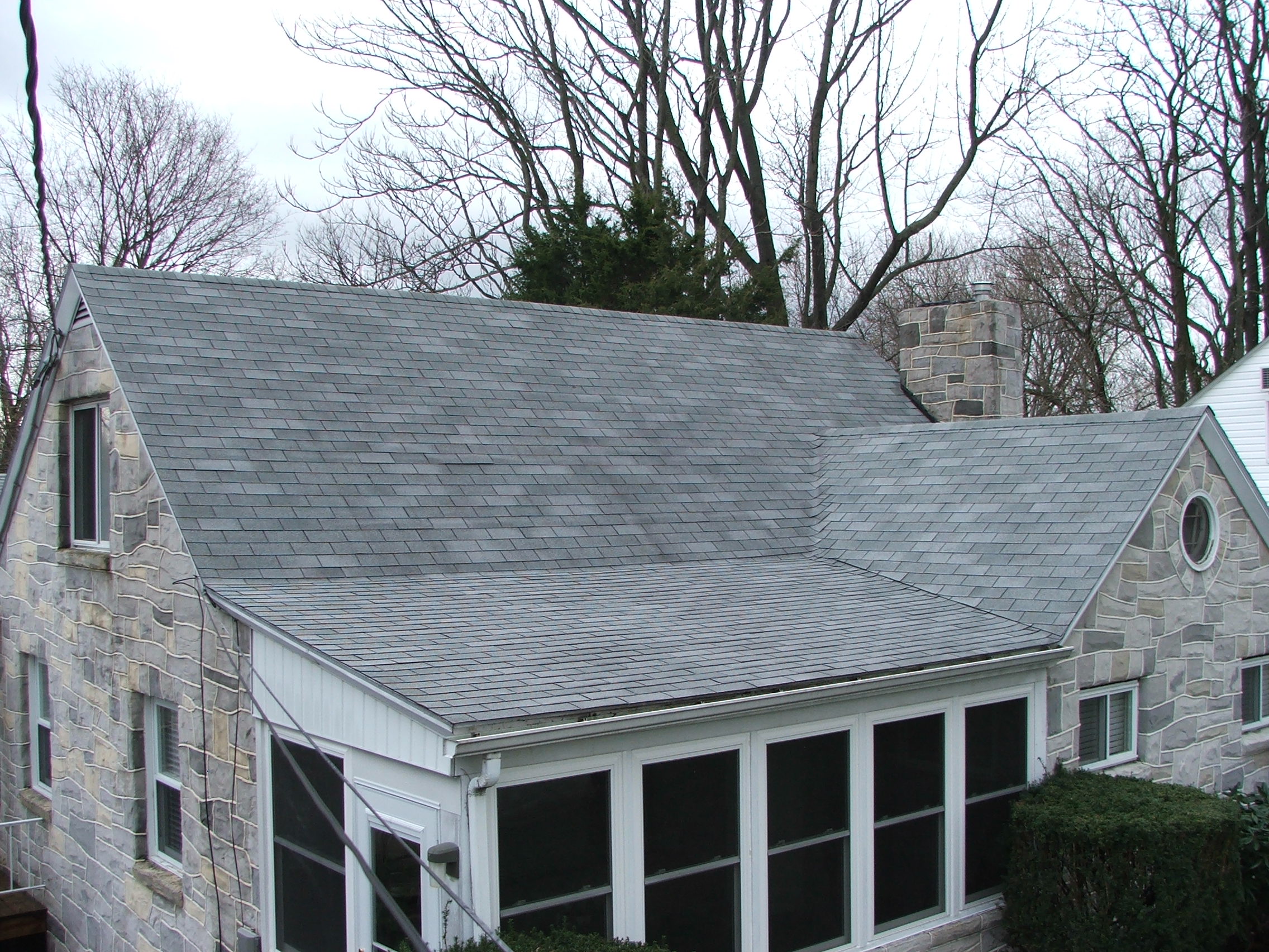 After low pressure washing and cleaning of a house roof in Harrisburg PA