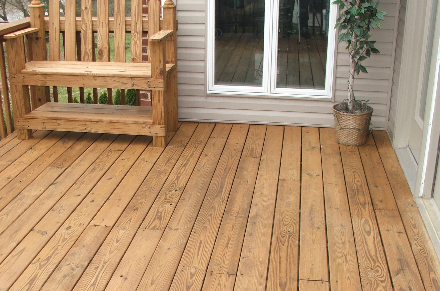 Wood deck after pressure washing and seal/staining protection using a cedar toner product. Typical three(3) year preformance.
